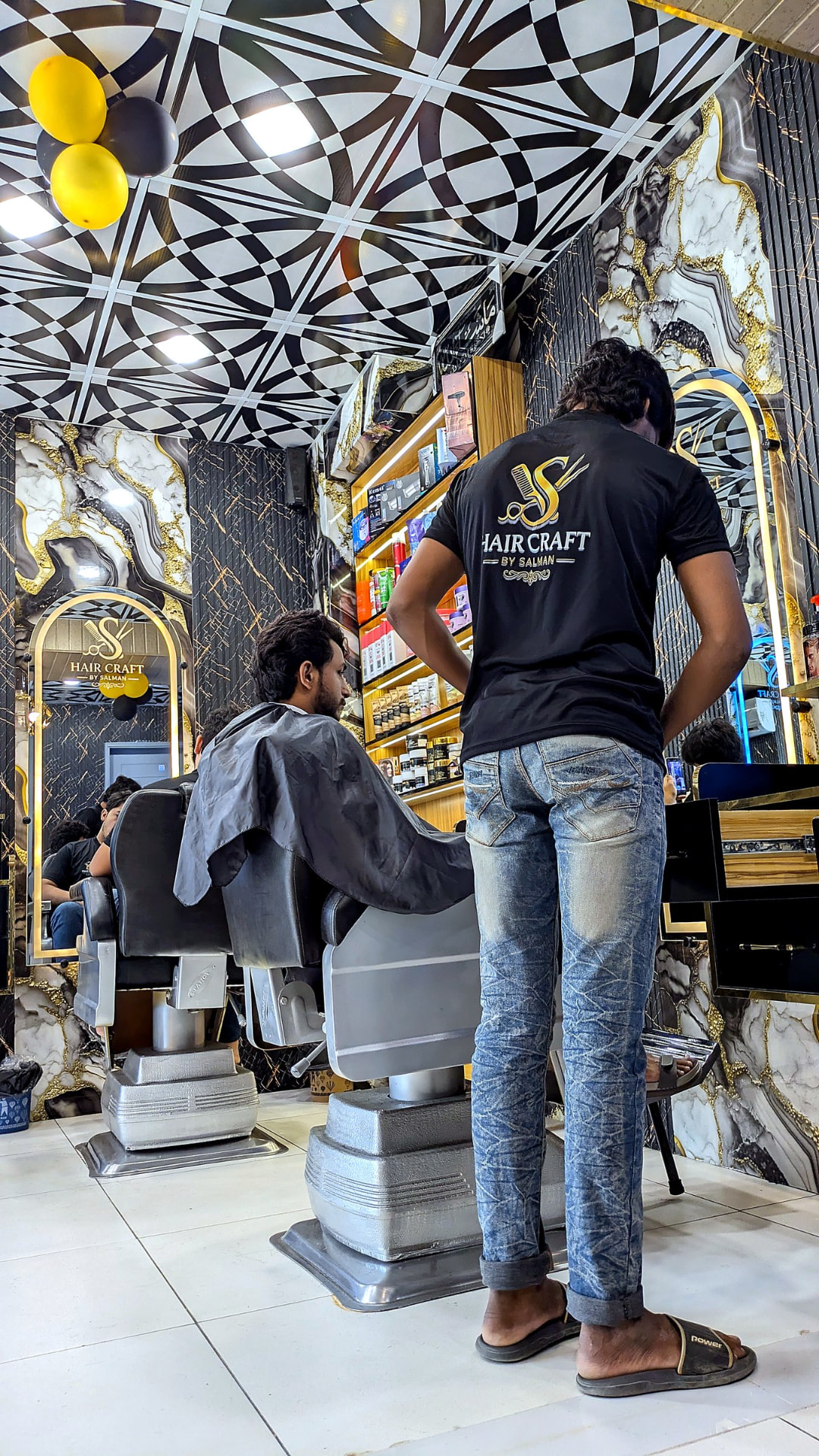 A trained Hair Craft barber cutting a client's hair